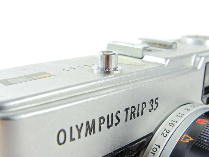 Olympus Trip 35 chrome shutter button - used