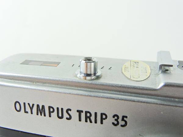 Olympus Trip 35 chrome shutter button - used